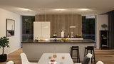 Modern white kitchen island with black countertop and wood slat wall, LED ceiling lights