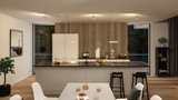 Modern white kitchen with wood panel wall and black bar stools, LED ceiling lights illuminating countertop