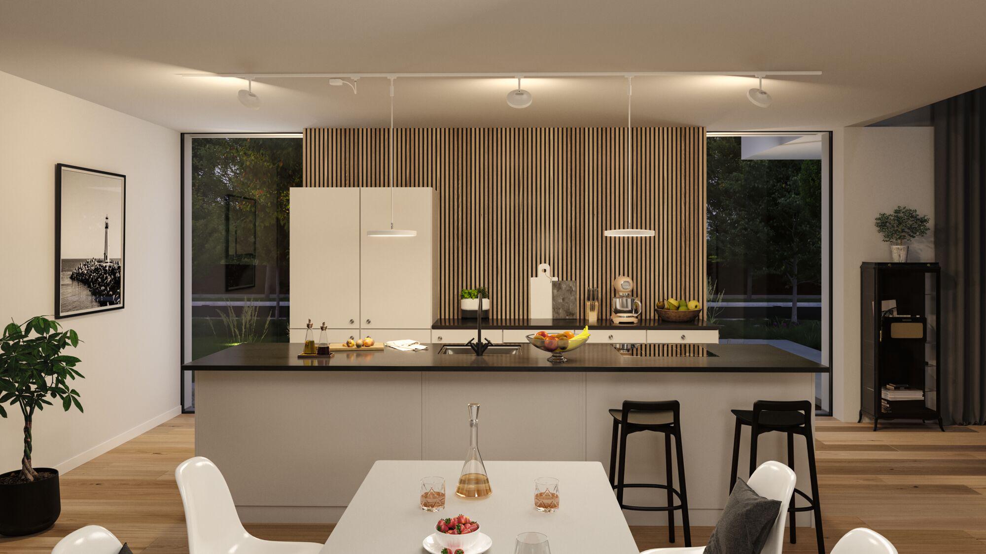 Modern white kitchen island with black countertop and wooden panel wall, ceiling LED lights