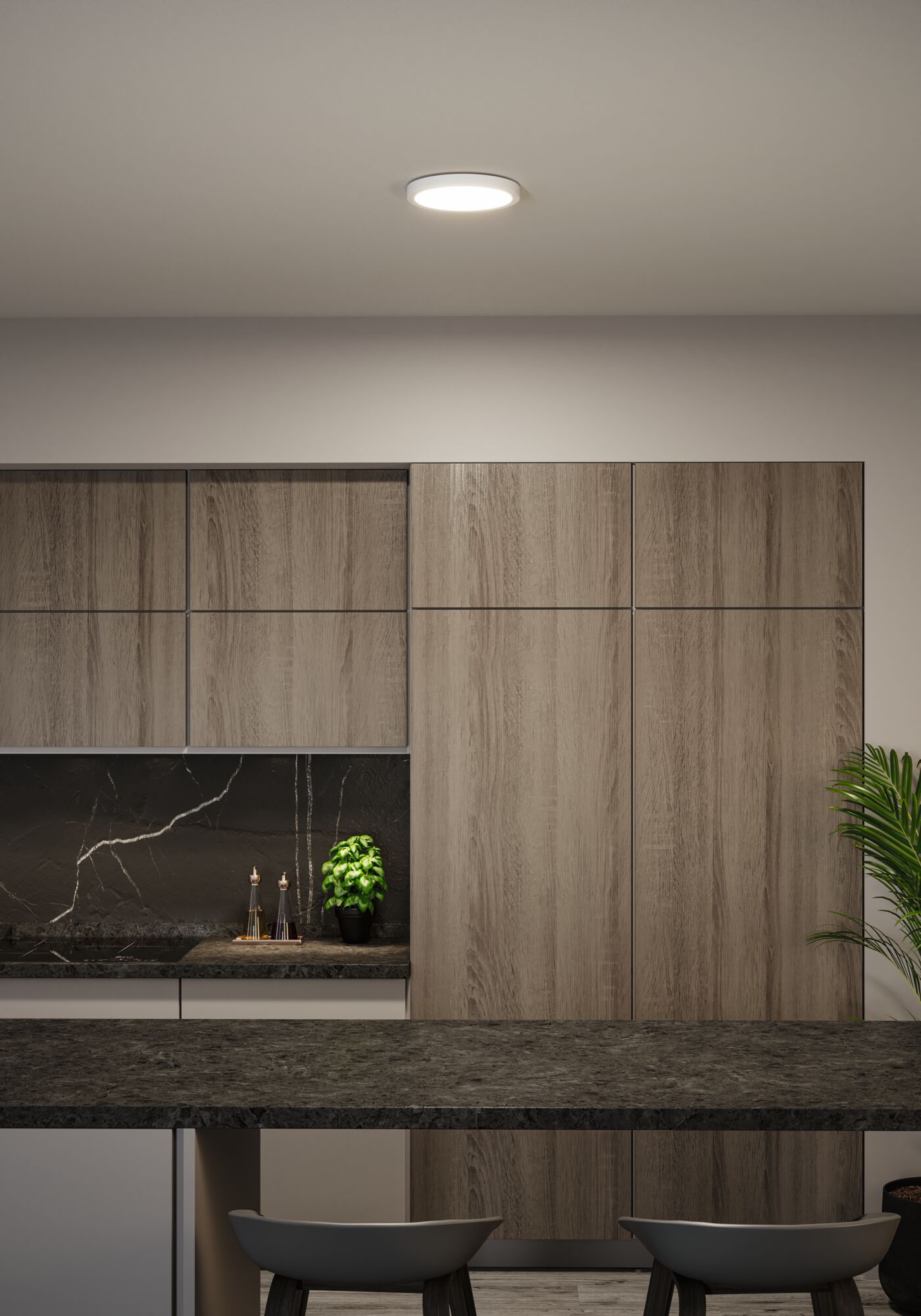 Runde weiße LED-Deckenleuchte in moderner Küche mit Holzfronten und schwarzer Arbeitsplatte