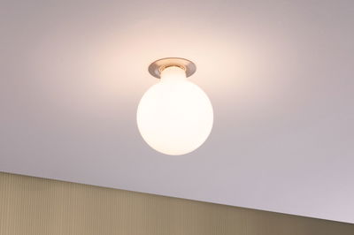 Round ceiling light with white glass and metal base, modern LED lighting for living spaces