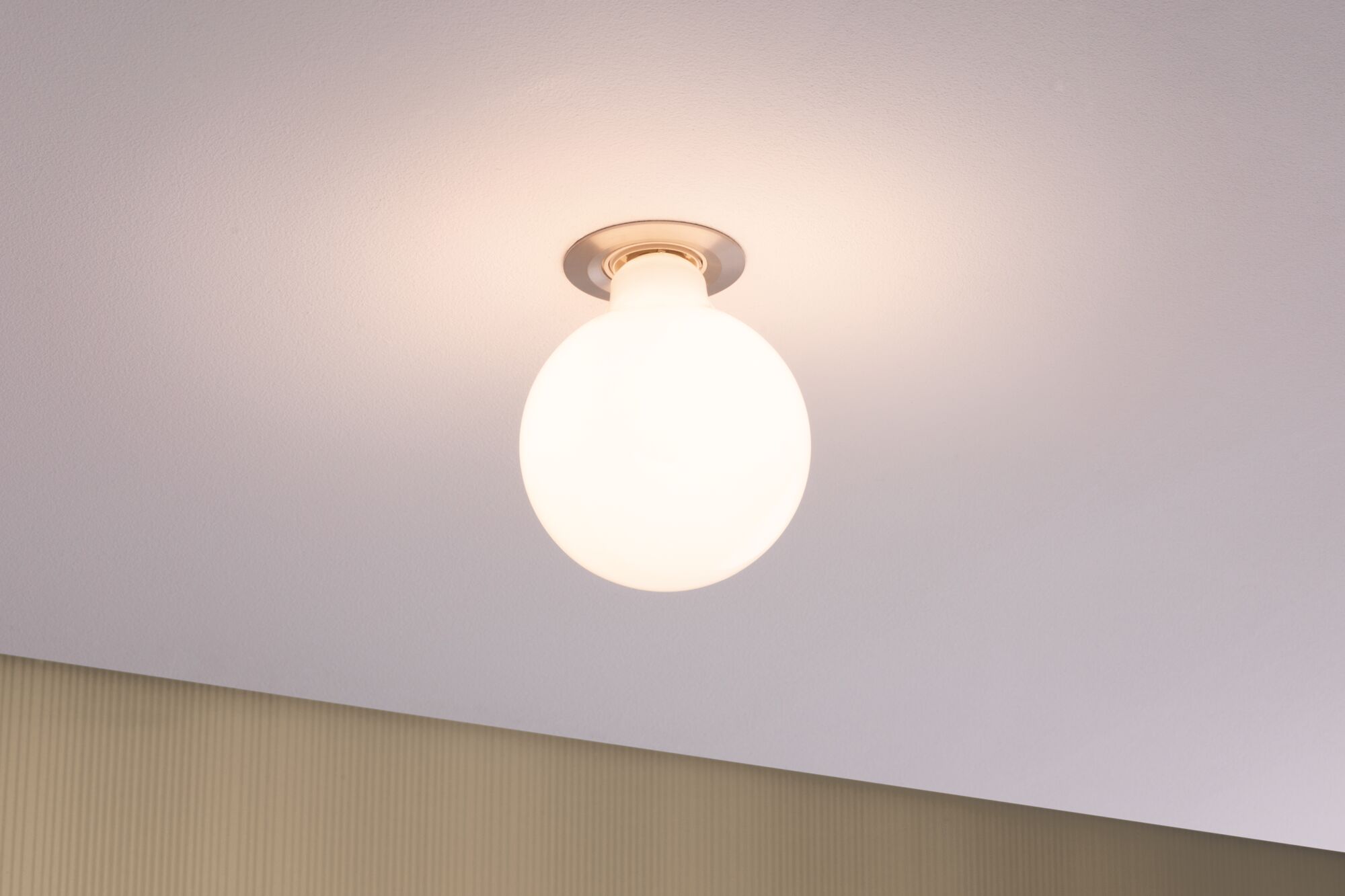 Round ceiling light with white glass and metal base, modern LED lighting for living spaces