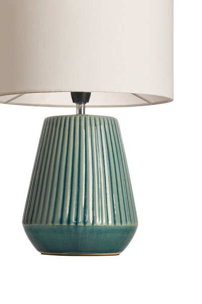 Table lamp with green ceramic base and white fabric shade for elegant home lighting