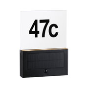 Black solar house number sign with illuminated acrylic glass showing number 47c for outdoor use