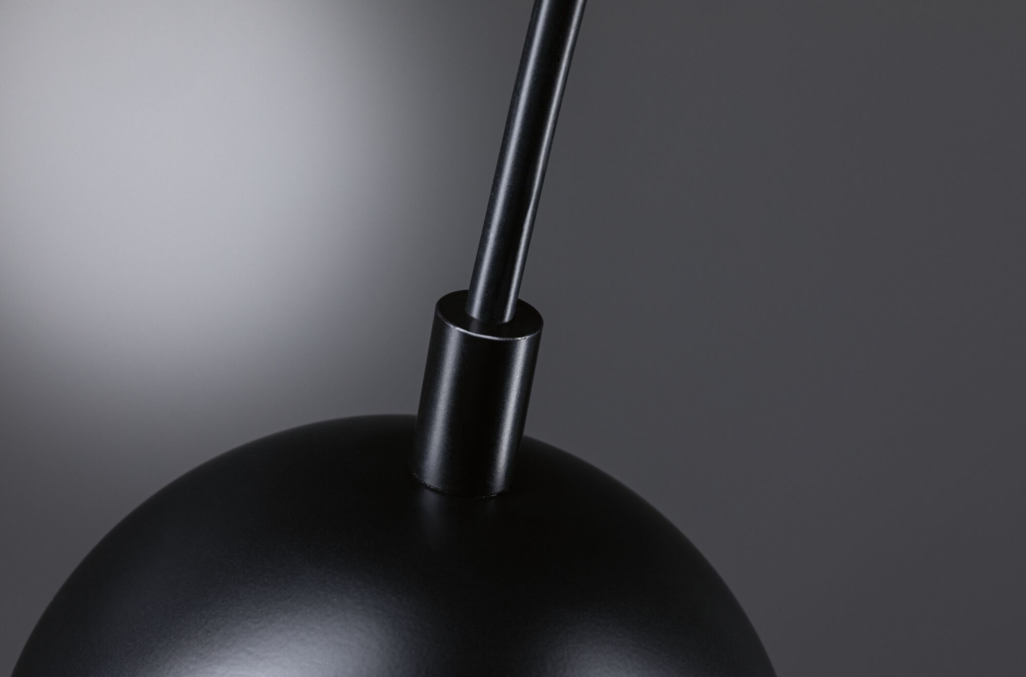 Black metal lampshade with rod in minimalist modern indoor lighting fixture