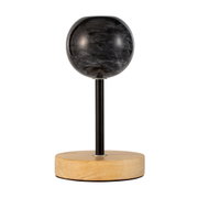 Modern table lamp with black marble globe shade and wooden base for stylish room lighting