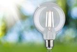 Klar glas LED-pære med synlige filamenter og E27-fatning til energieffektiv belysning