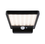 Black LED outdoor wall light with motion sensor providing bright illumination for home safety