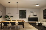 Moderne eetkamer met zwarte hanglampen en plafondlamp in minimalistisch design en houten eettafel.