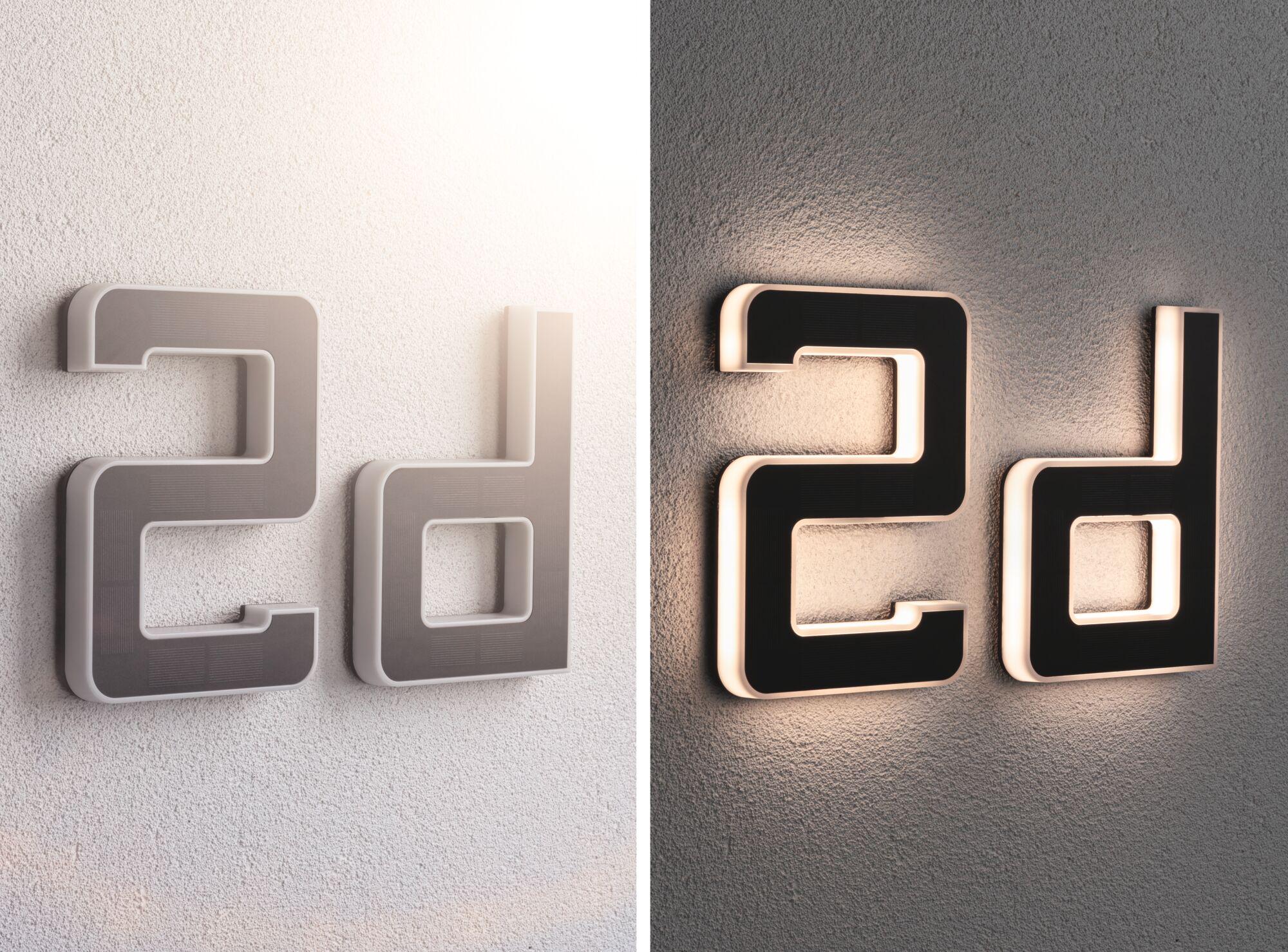 Moderne Hausnummer 2d aus schwarzem Material mit weißer LED-Beleuchtung an Wand montiert