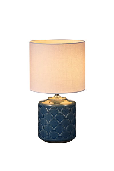 Table lamp with blue ceramic base and white fabric shade for ambient lighting
