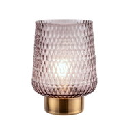 Decorative table lamp with textured pink glass and gold metal base for ambient lighting in living spaces