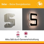 Solarbetriebene Wandlampe in Schwarz und Weiß mit LED-Beleuchtung und Energiesparfunktion