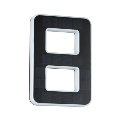 Rectangular black solar light with white edges and two rectangular cutouts for outdoor lighting