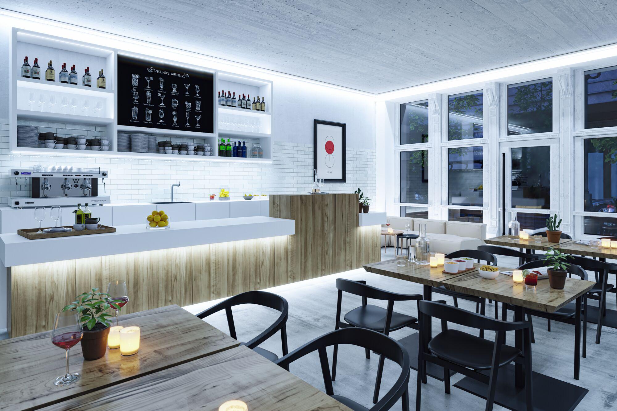 Modern café met houten balie, witte tegels en LED-verlichting voor een gezellige horecaomgeving.
