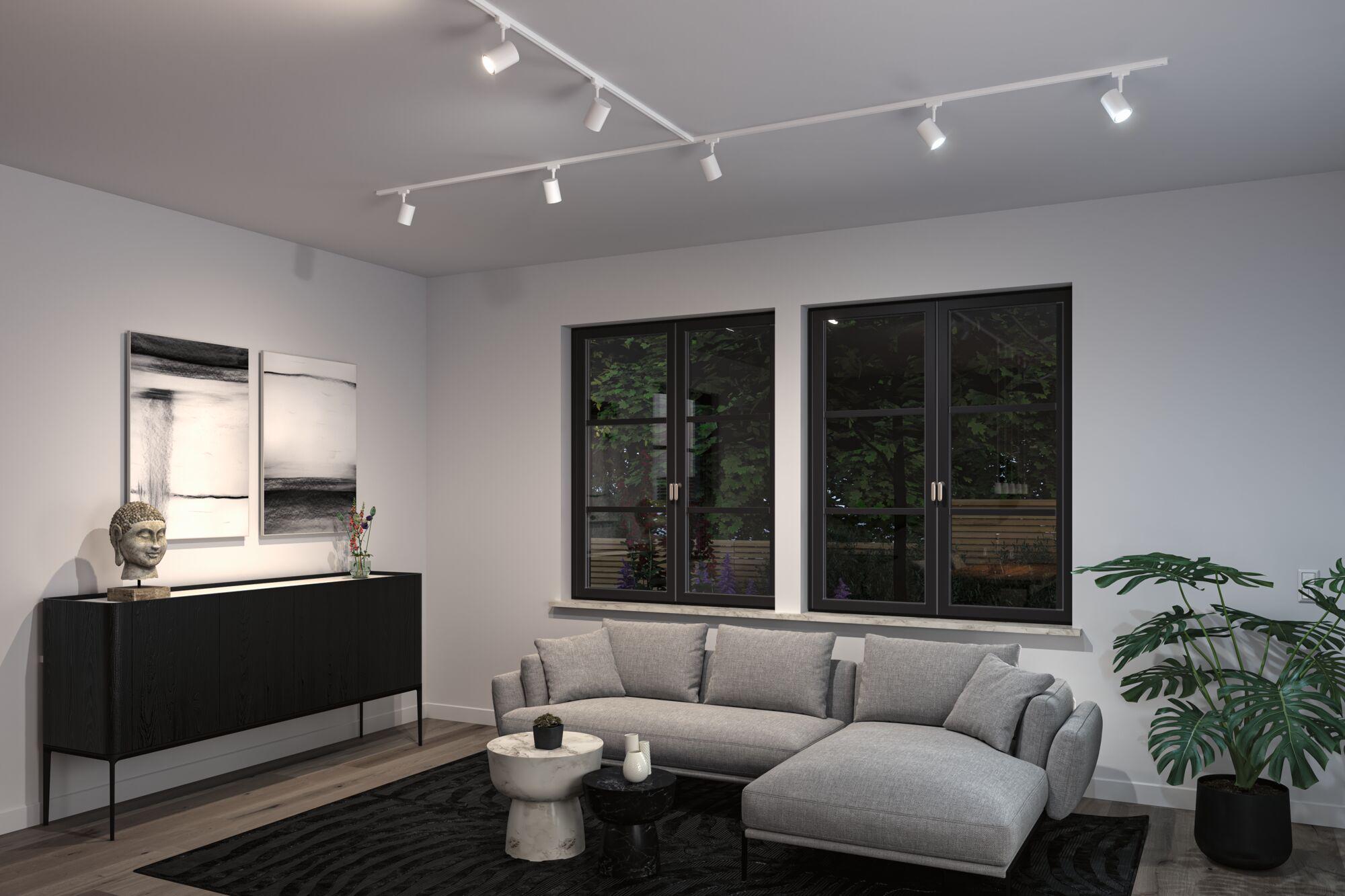 Modern living room with white LED track lighting on ceiling and grey Scandinavian style sofa