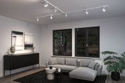 Modern living room with white LED track lighting on ceiling and grey Scandinavian style sofa