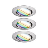Three round recessed spotlights in brushed aluminum with colorful shimmering glass for LED lighting