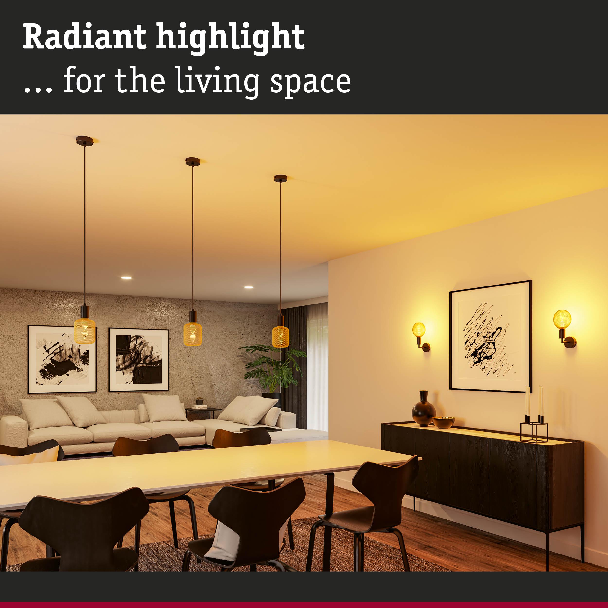 Modern living room with amber pendant and wall lights providing warm white ambient lighting