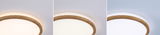 Round ceiling light with wooden frame in three light colors for modern living spaces