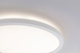Round white LED ceiling light with indirect glow on wall for modern ambient lighting