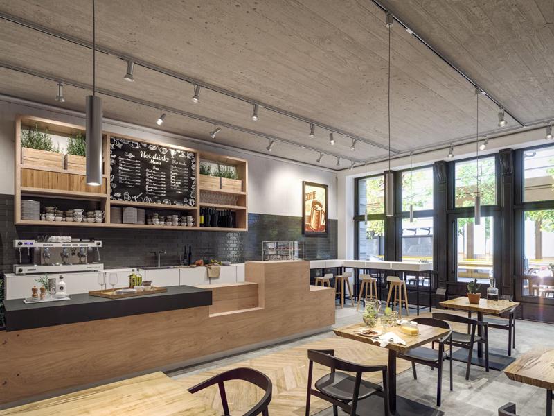 Modernes Café mit Holztheke, schwarzen Stühlen und Deckenstrahlern für gemütliche Beleuchtung.