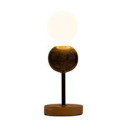 Modern table lamp with wooden base and dark marble sphere, warm white light for living spaces