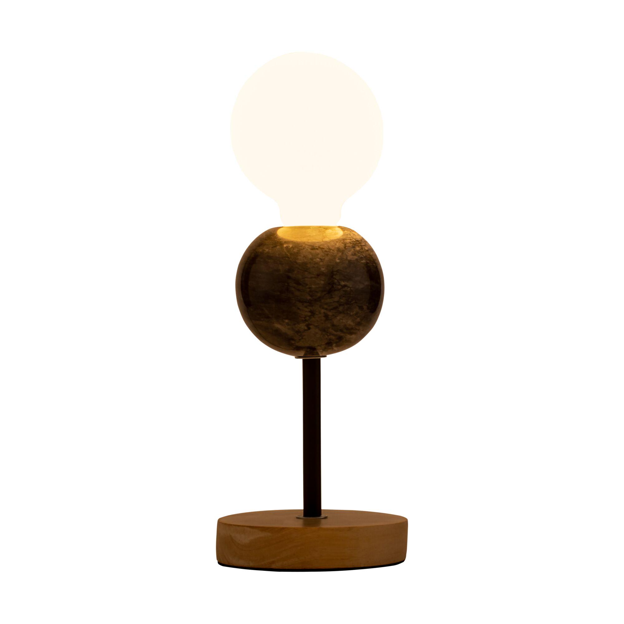 Modern table lamp with wooden base and dark marble sphere, warm white light for living spaces