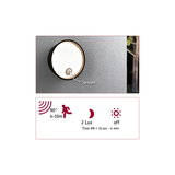 Round black outdoor wall light with sensor and white illumination for energy-efficient lighting