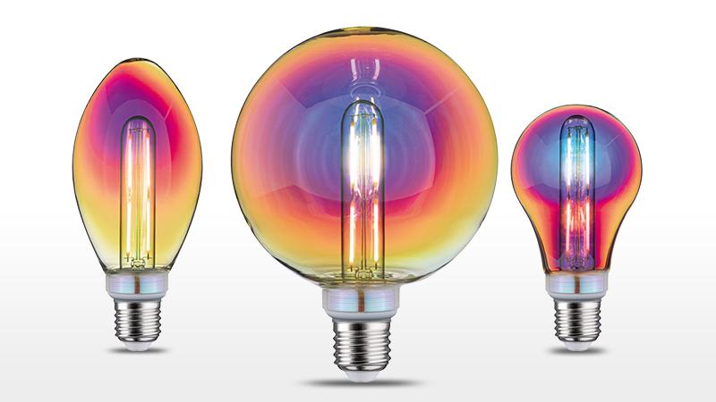 Three colorful LED bulbs with iridescent glass in various shapes and sizes for decorative lighting.