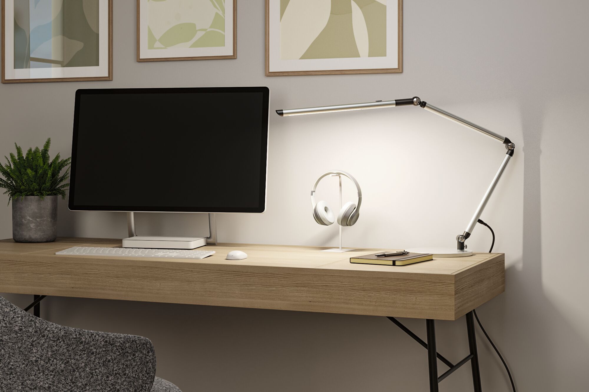 Modern wooden desk with aluminum LED task lamp and white headphone stand in home office setup