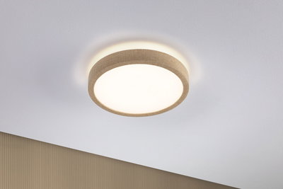 Round ceiling light with beige fabric edge and warm white light for modern interiors