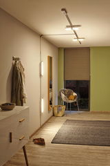 Modern hallway lighting with LED ceiling and wall lamps emitting warm white light for cozy rooms