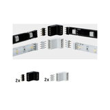Four black and white LED strip connectors with pins for flexible light strip installation