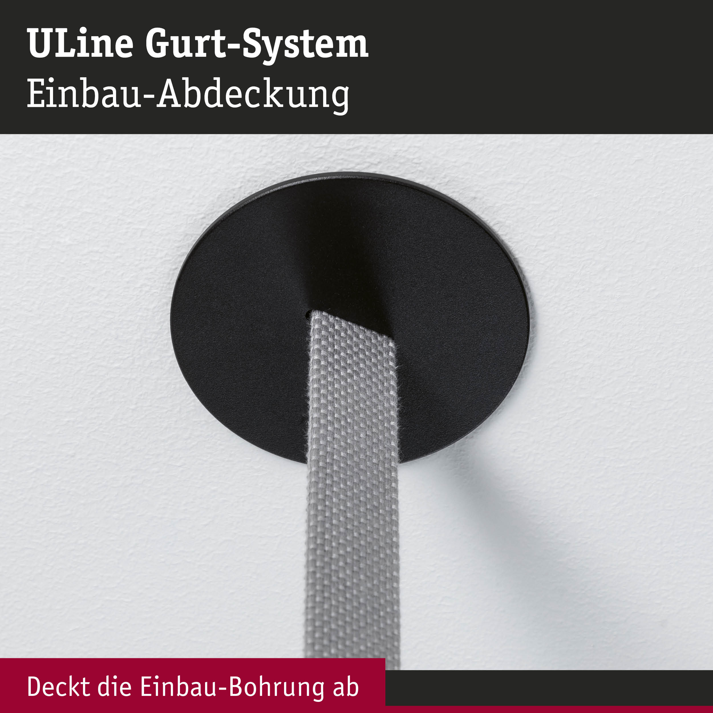 Schwarze Einbau-Abdeckung aus Kunststoff für ULine Gurt-System mit grauem Gurtband an weißer Wand