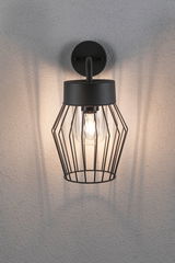 Black metal wall light with cage design and visible bulb for modern indoor lighting