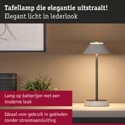 Elegante tafellamp in grijze lederlook met modern design, ideaal voor draadloze verlichting