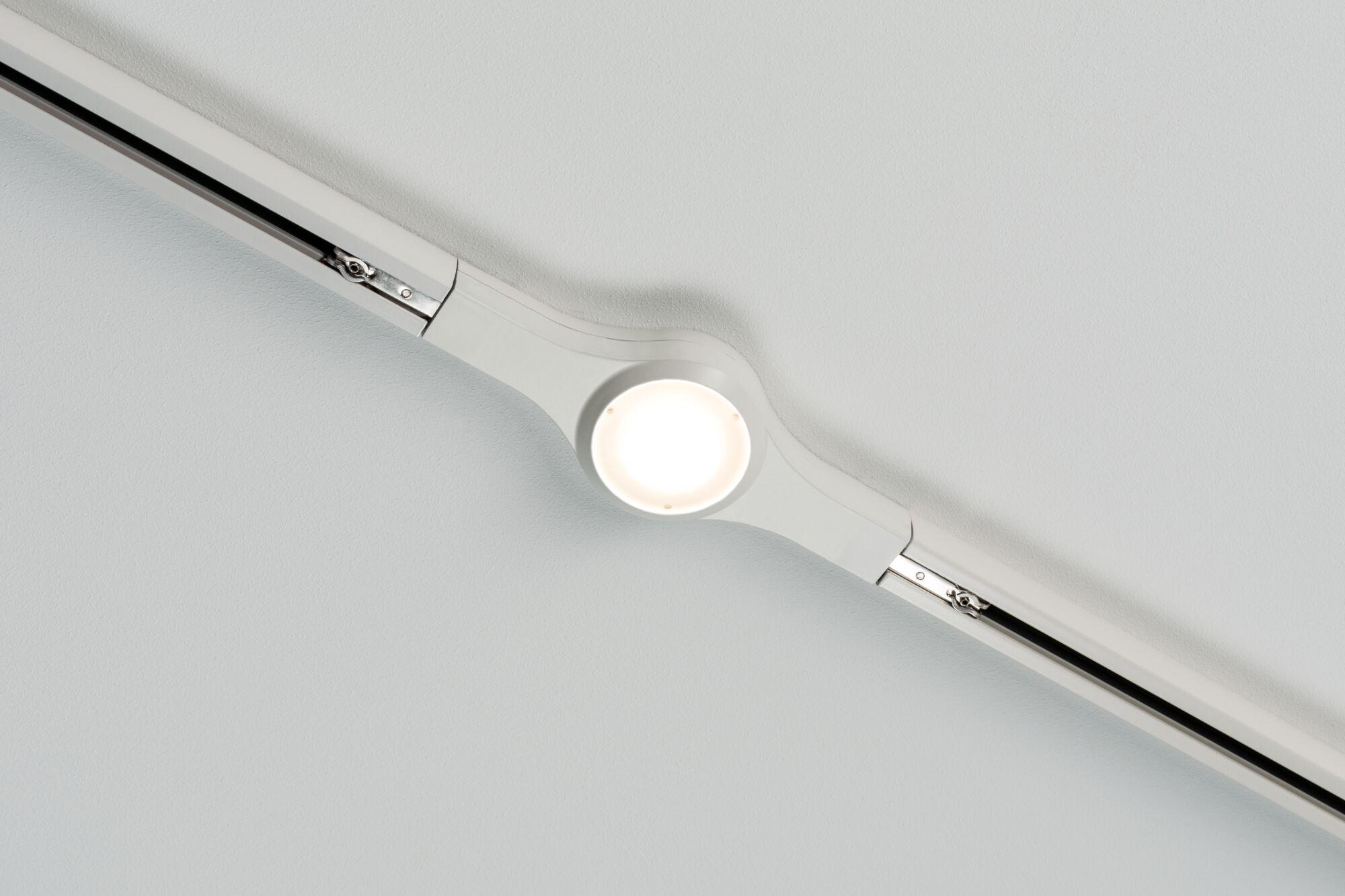 White LED track lighting with round plastic light fixture mounted on ceiling