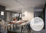 Modern dining room with wooden table and white pendant lights, white track lighting on ceiling for accent illumination