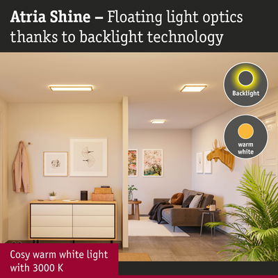 Living room with Atria Shine ceiling lights emitting cosy warm white light with backlight technology