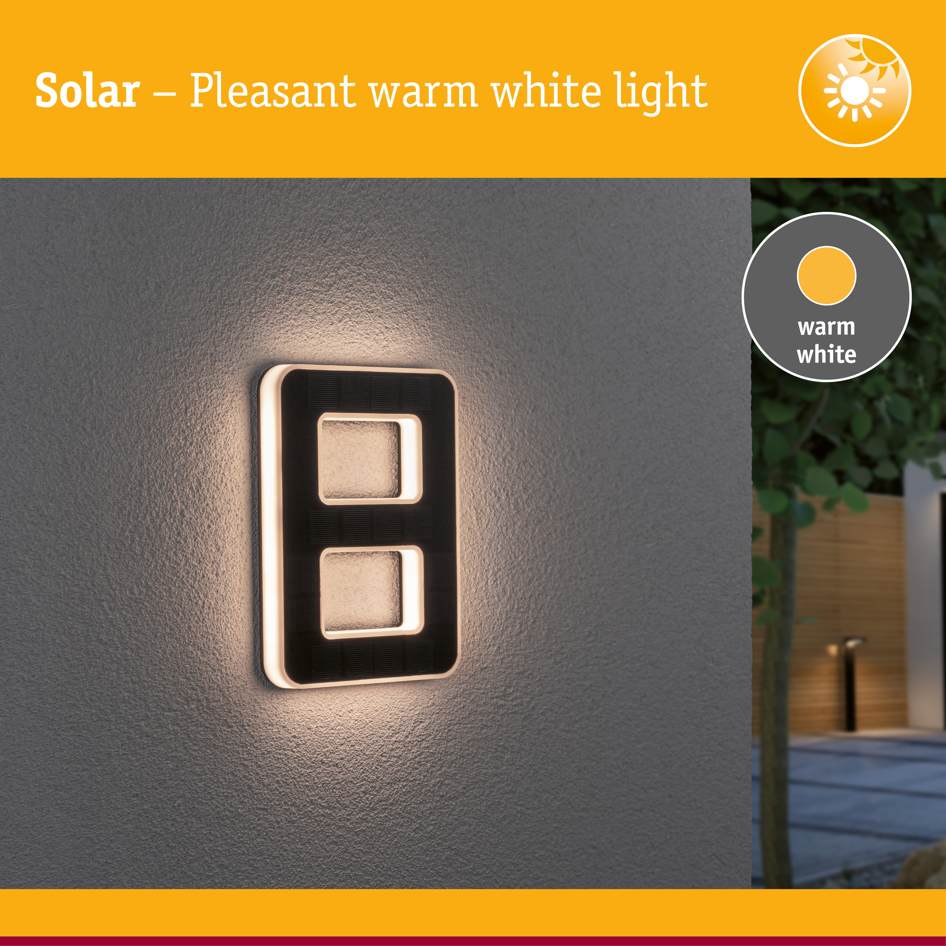Solar outdoor wall light with warm white illumination and sleek black design mounted on grey wall