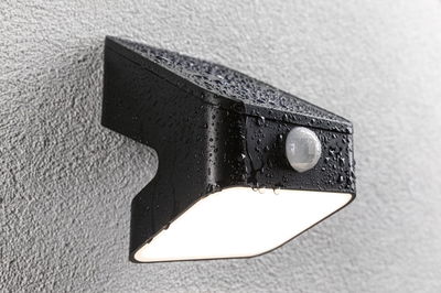 Black metal outdoor wall light with motion sensor and waterproof design for garden lighting