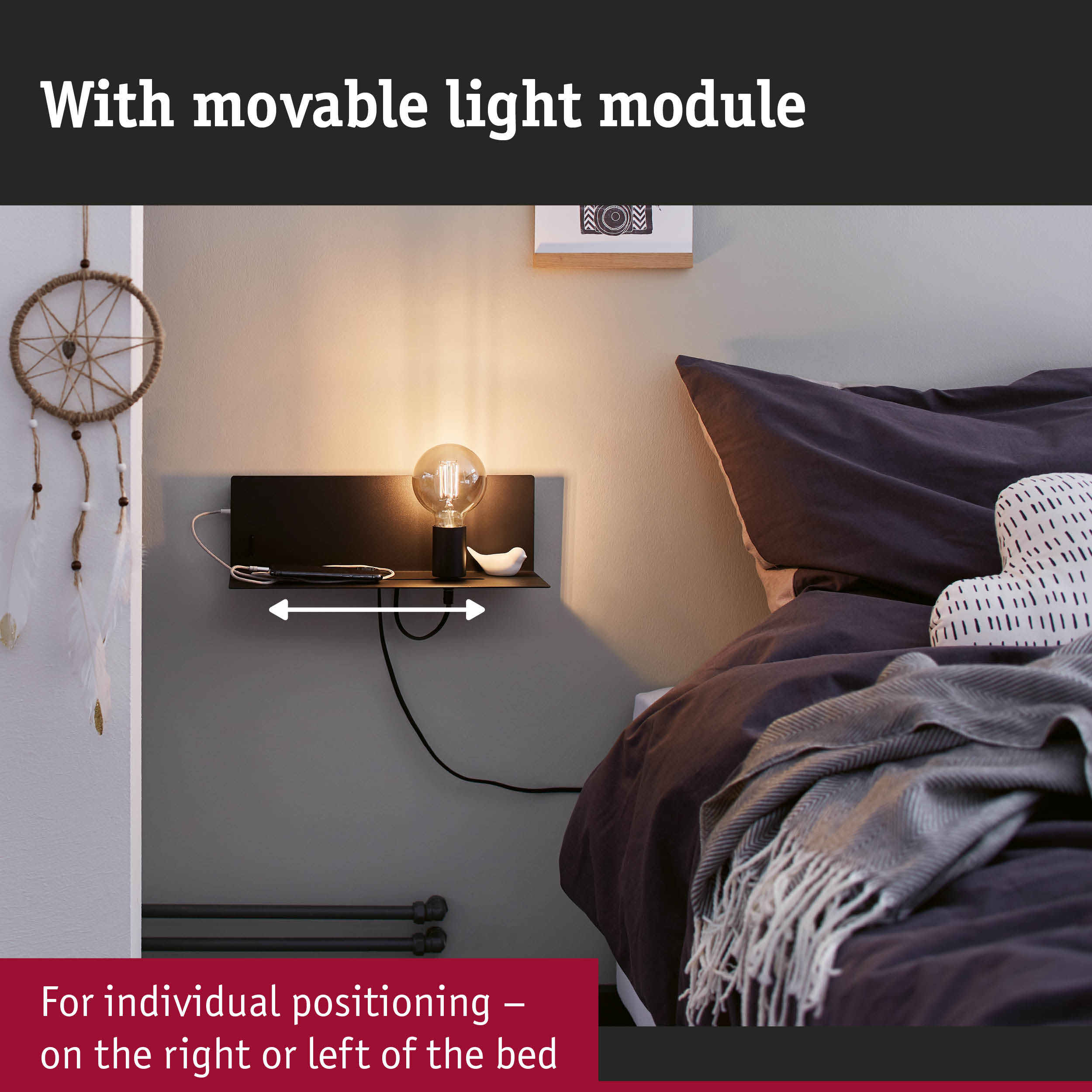 Black wall lamp with movable light module beside bed with dark pillows and blanket