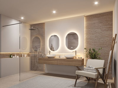 Modernes Badezimmer mit zwei ovalen, beleuchteten Spiegeln und Holzwaschtisch in natürlichem Braunton
