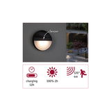 Round black outdoor wall light with sensor and warm white LED, energy-saving garden lighting.