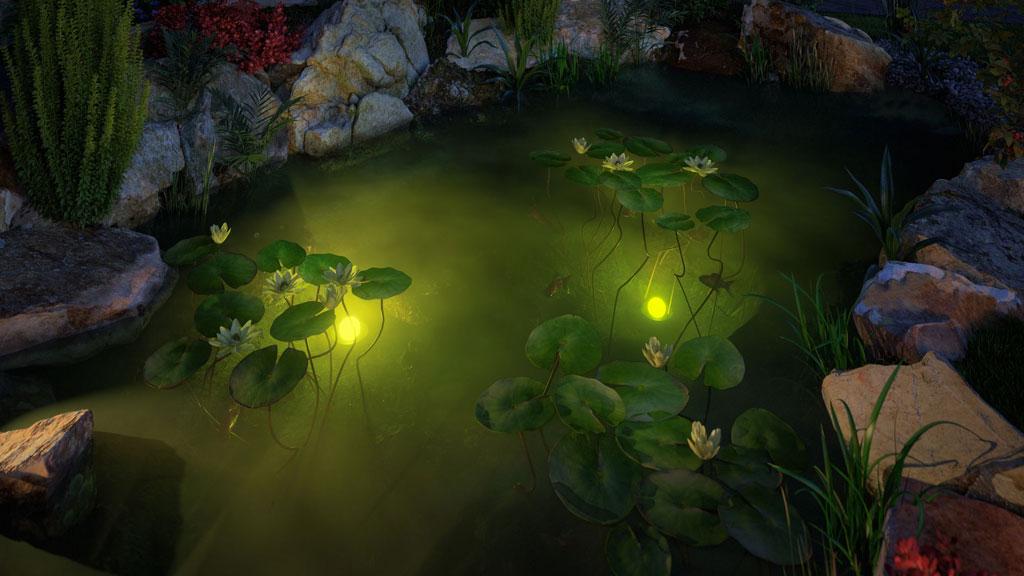 Yellow underwater pond lighting with water lilies and rocks for atmospheric garden decoration.