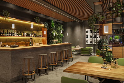 Modernes Barinterieur mit Holztheke, grünen Sitzmöbeln und weißen Pendelleuchten für Gastronomiebeleuchtung.