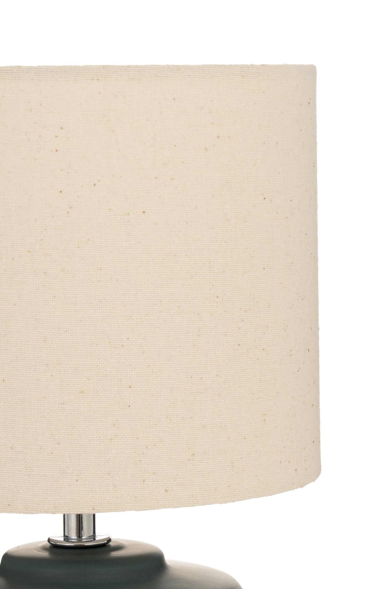 Table lamp with cream fabric shade and dark green base for cozy ambient lighting