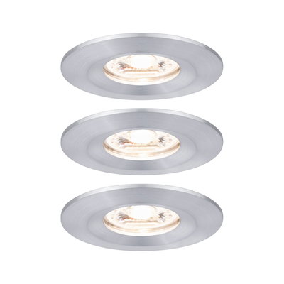 Three round recessed spotlights in brushed silver aluminum with warm white light for living spaces