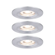 Three round recessed spotlights in brushed silver aluminum with warm white light for living spaces